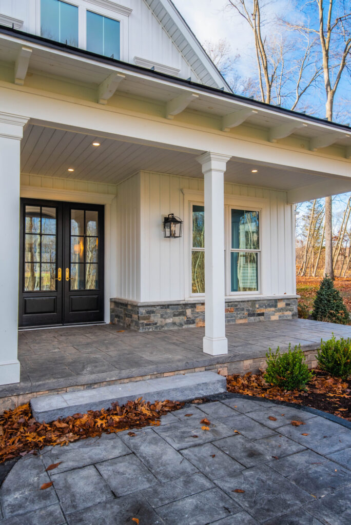 a white house with a black front door